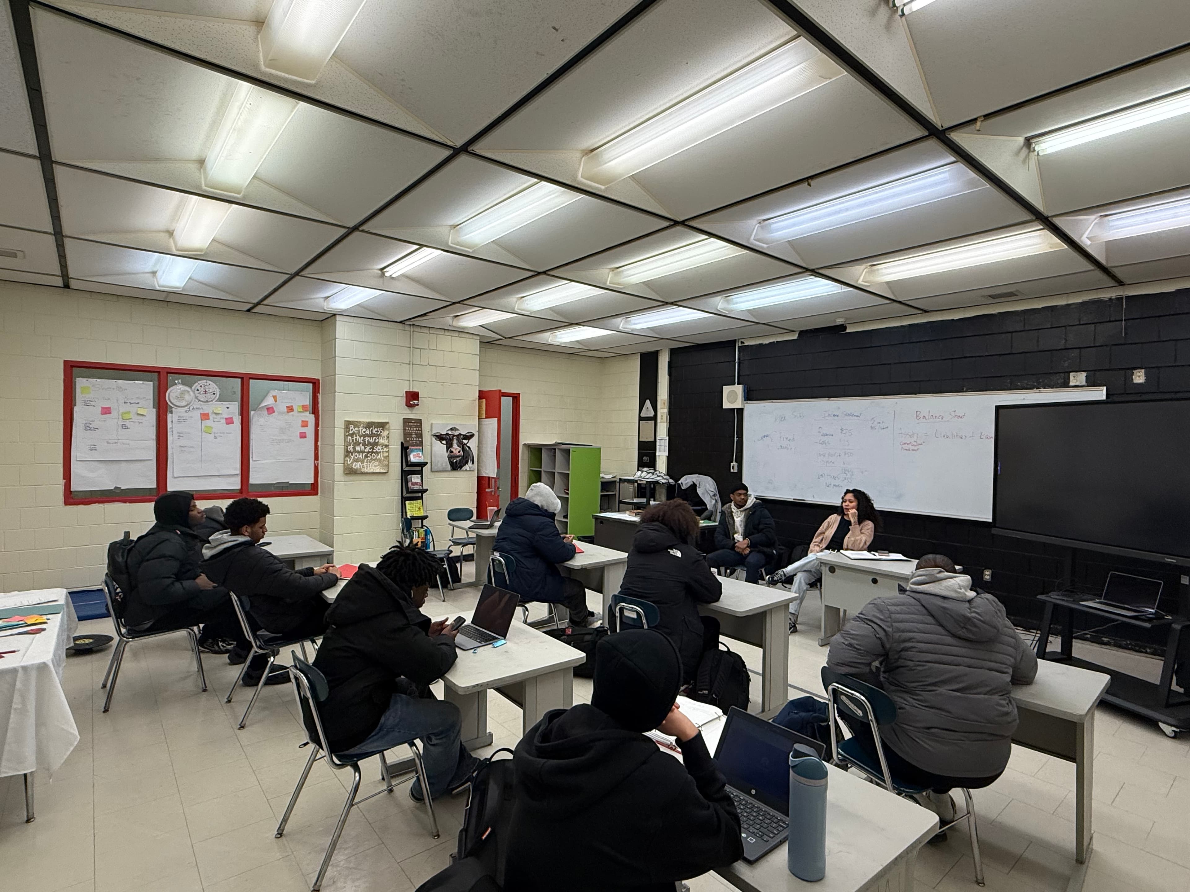 A wide view of a REBELS classroom with students engaged in a session